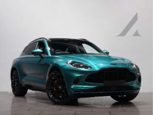 Front three-quarter view of a turquoise Aston Martin DBX
