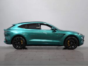 Side view of a turquoise Aston Martin DBX
