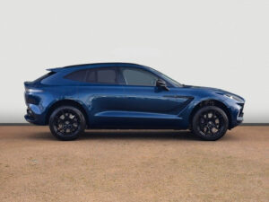Side view of a blue Aston Martin DBX