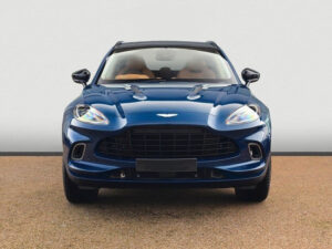 Front view of a blue Aston Martin DBX